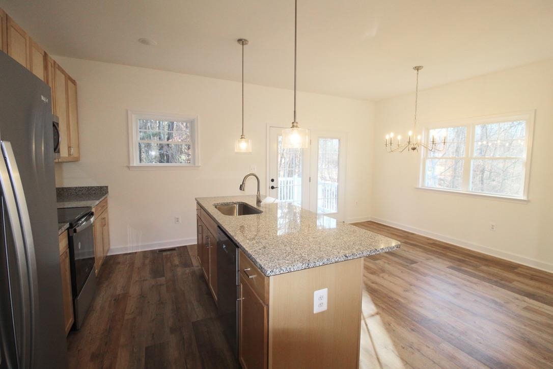 1537 Palomino Trail Harrisonburg, VA 22801 - Photo 12 of 33 a kitchen with granite countertop a sink a counter top space and cabinets