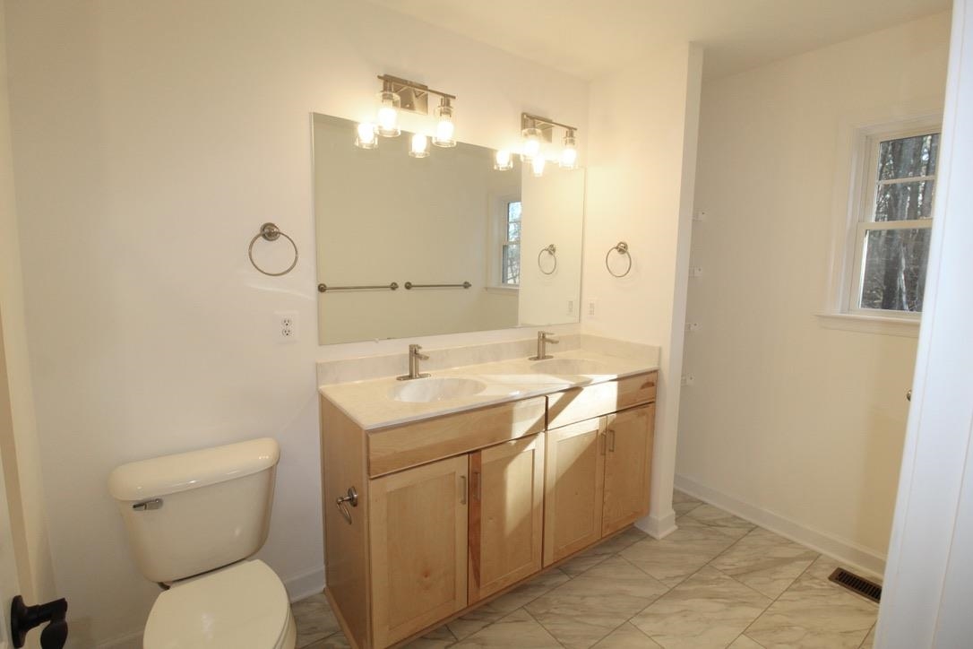 1537 Palomino Trail Harrisonburg, VA 22801 - Photo 25 of 33 a bathroom with a toilet sink and mirror