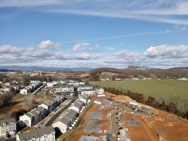 a aerial view of a house with a yard