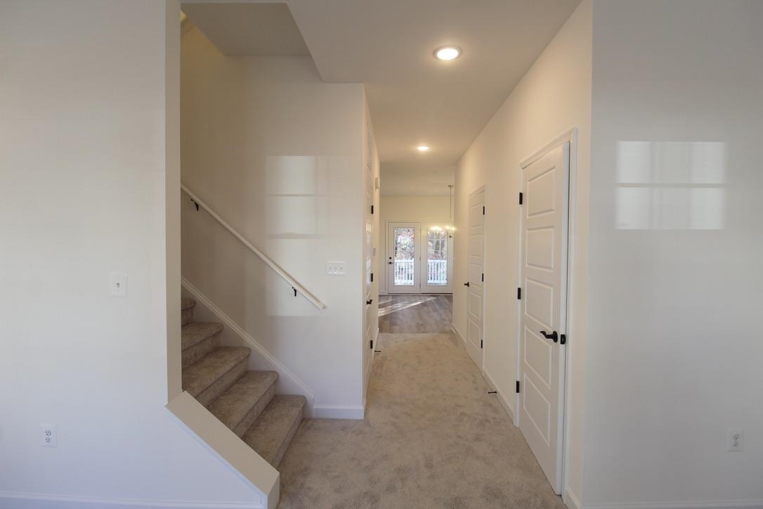 1537 Palomino Trail Harrisonburg, VA 22801 - Photo 5 of 33 a view of a hallway with white walls and stairs