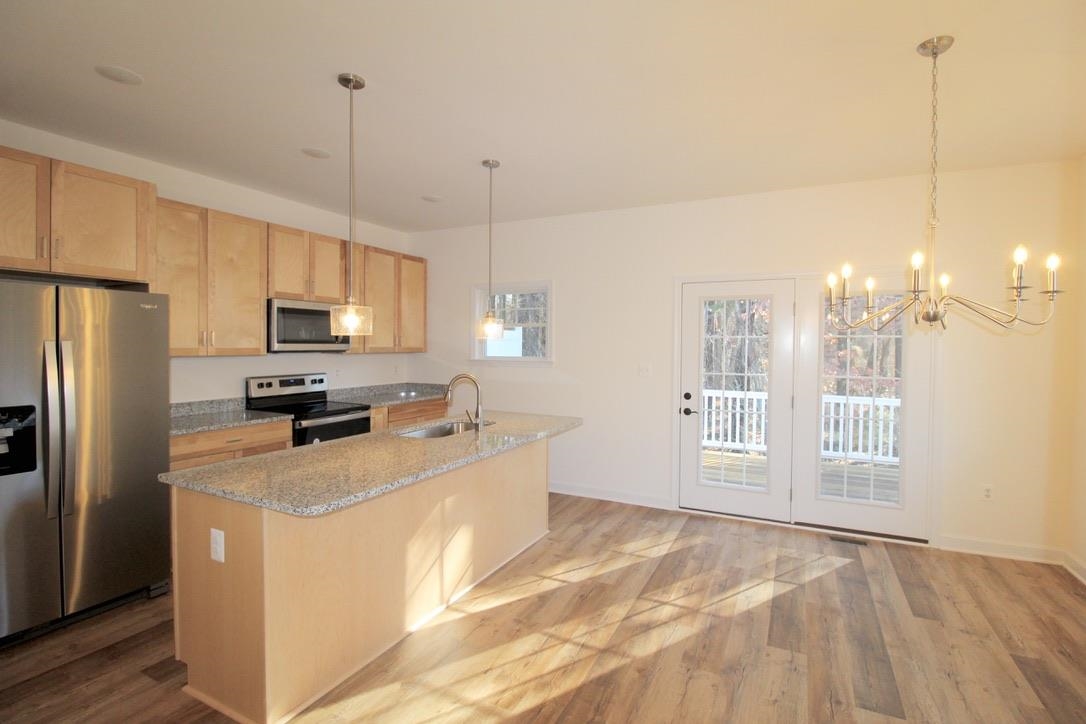 1537 Palomino Trail Harrisonburg, VA 22801 - Photo 7 of 33 a kitchen with stainless steel appliances granite countertop a refrigerator a stove a sink and a center island