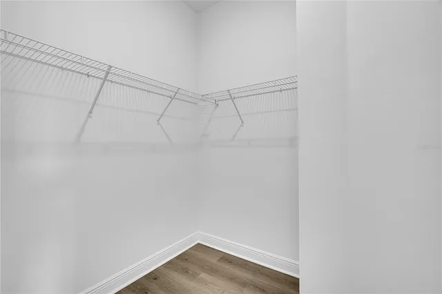 a bathroom with a bathtub a sink and a window