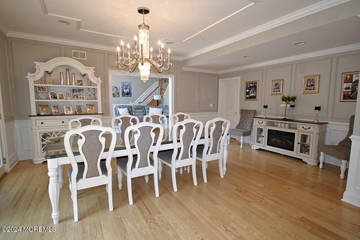 111 Wiseman Road Jackson, NJ 08527 - Photo 12 of 65 a view of a dining room with furniture wooden floor and chandelier