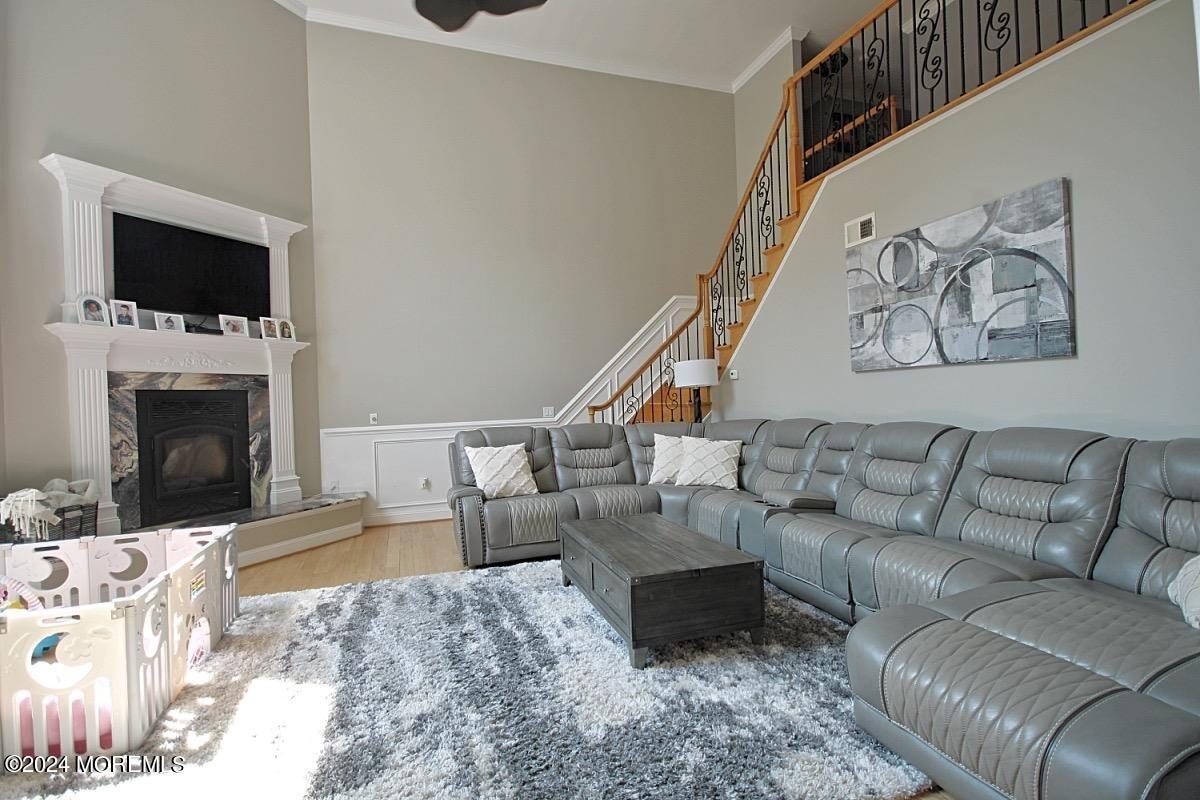 111 Wiseman Road Jackson, NJ 08527 - Photo 15 of 65 a living room with furniture and a fireplace