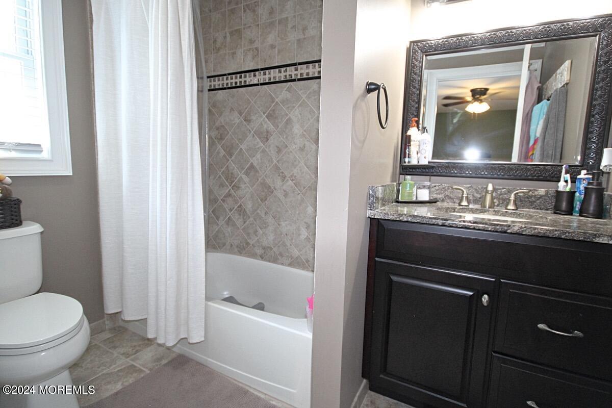111 Wiseman Road Jackson, NJ 08527 - Photo 23 of 65 a bathroom with a bathtub sink vanity mirror and toilet