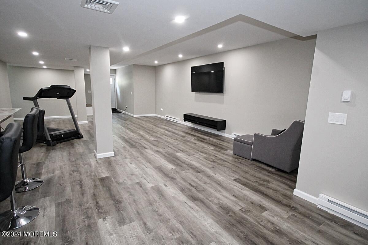111 Wiseman Road Jackson, NJ 08527 - Photo 38 of 65 a living room with furniture and a flat screen tv
