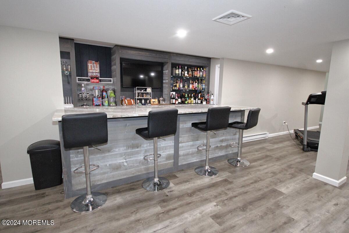 111 Wiseman Road Jackson, NJ 08527 - Photo 39 of 65 a kitchen with a dining table chairs and view of living room