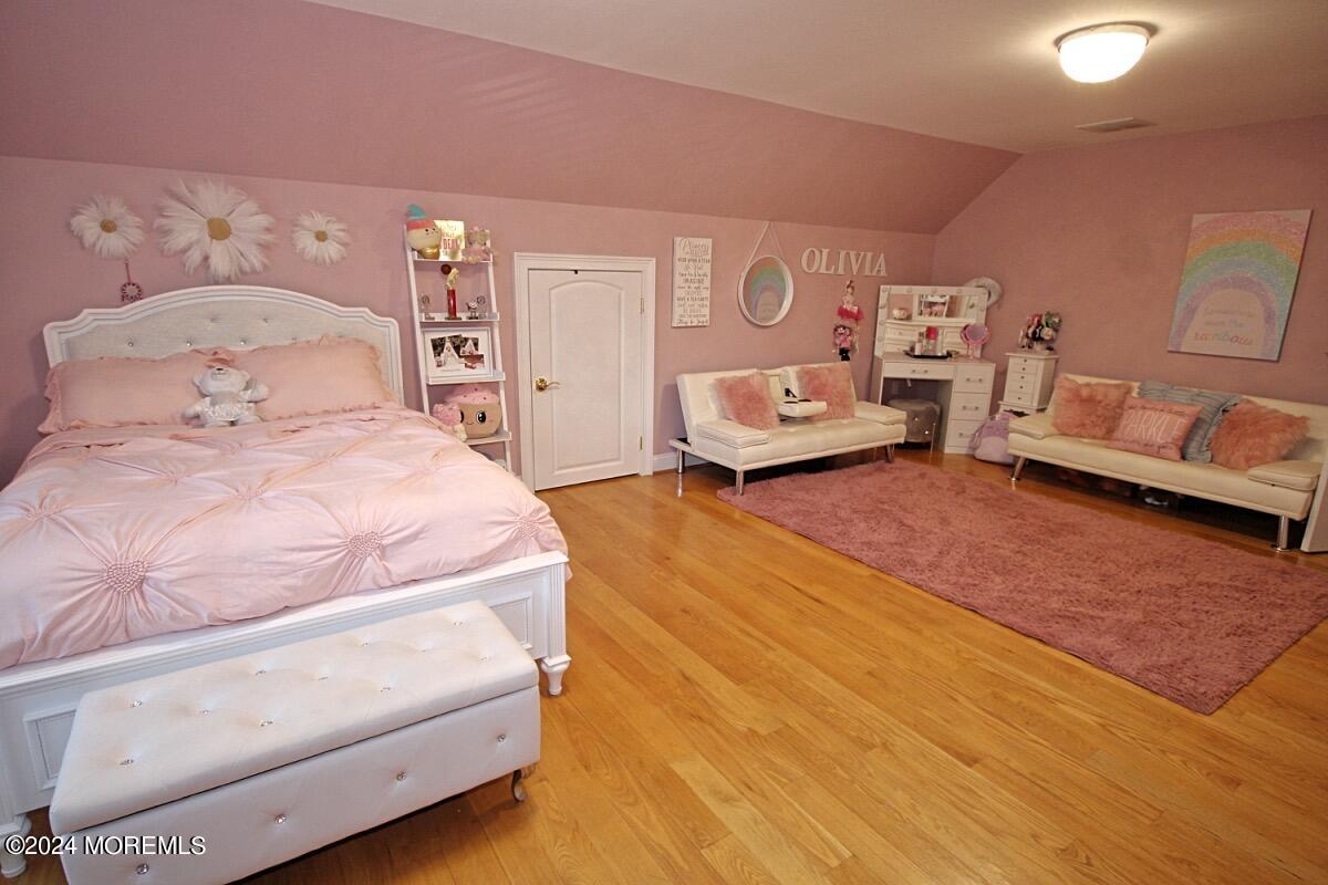 111 Wiseman Road Jackson, NJ 08527 - Photo 47 of 65 a spacious bedroom with a bed and a couch