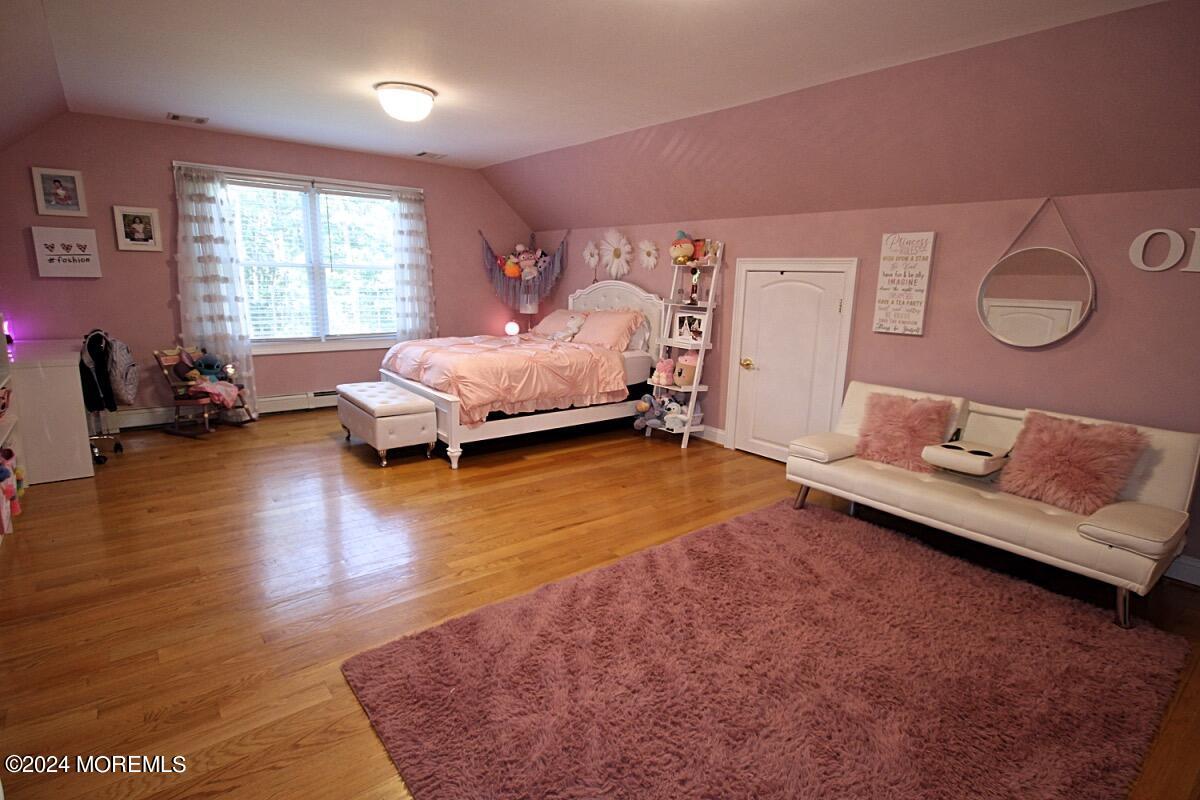 111 Wiseman Road Jackson, NJ 08527 - Photo 48 of 65 a spacious bedroom with a bed and wooden floor