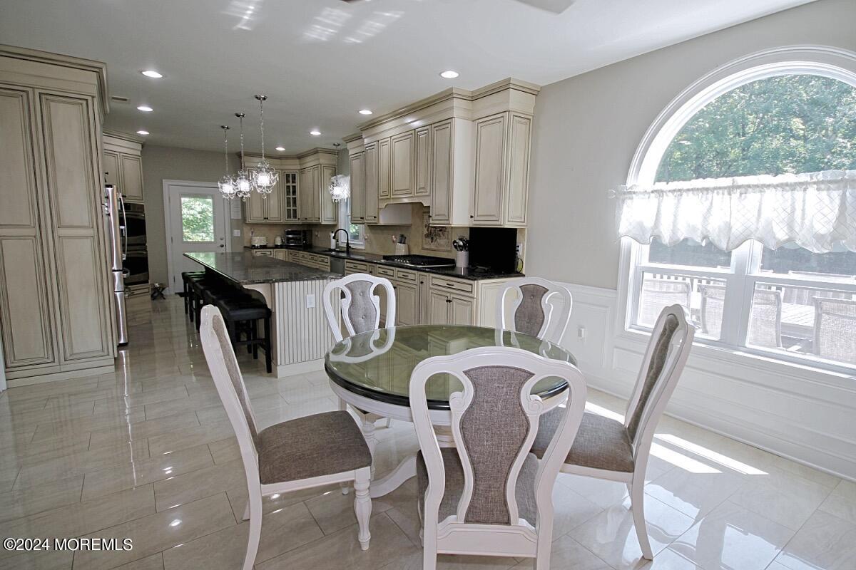 111 Wiseman Road Jackson, NJ 08527 - Photo 5 of 65 a dining room with furniture and a large window