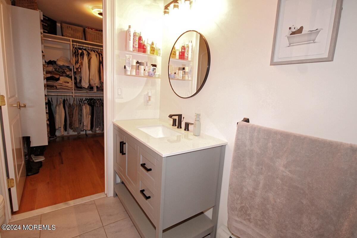 111 Wiseman Road Jackson, NJ 08527 - Photo 54 of 65 a bathroom with a sink a mirror and a shower