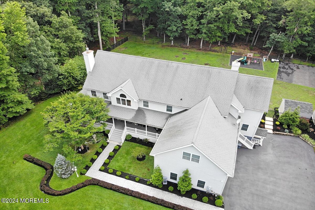 111 Wiseman Road Jackson, NJ 08527 - Photo 62 of 65 an aerial view of a house with a yard and lake view