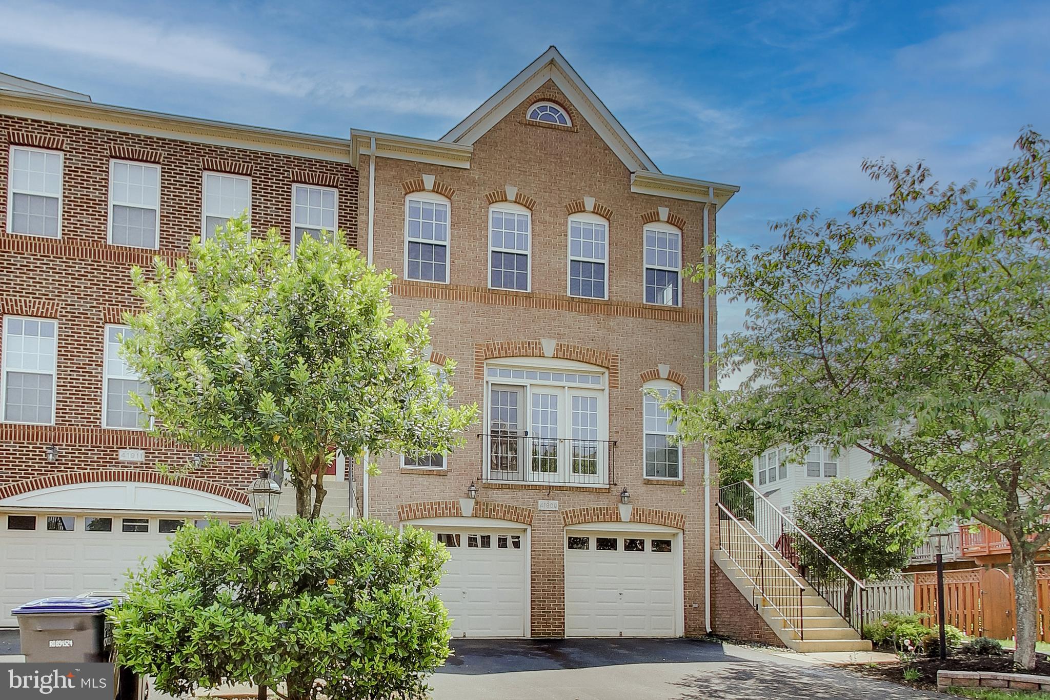 41909 Beryl Terrace Aldie, VA 20105 - Photo 1 of 4 a front view of a house with a yard and tree s