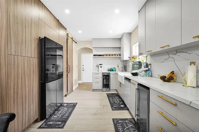 a living room with furniture a fireplace and a table