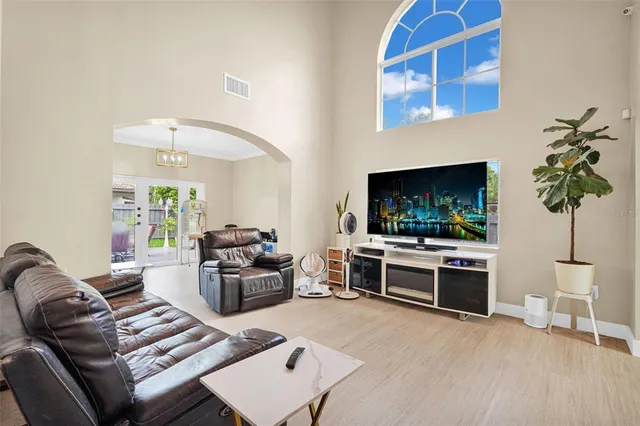 a view of a livingroom with furniture and flat screen tv
