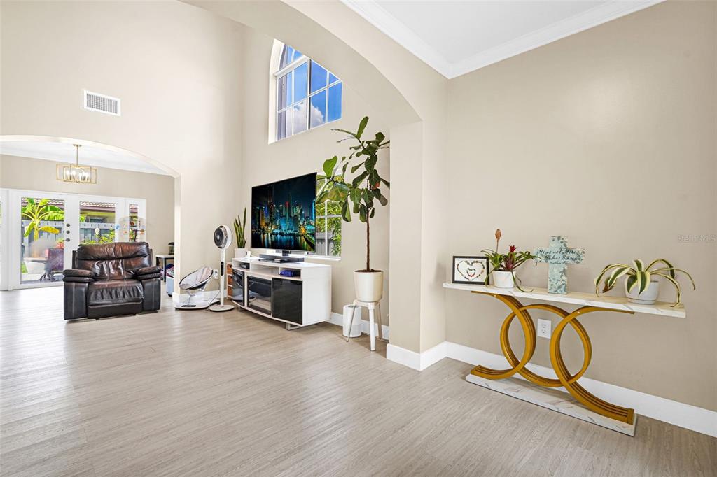 14402 Southwest 157th Path Miami, FL 33196 - Photo 19 of 80 a living room with furniture gym equipment and a flat screen tv