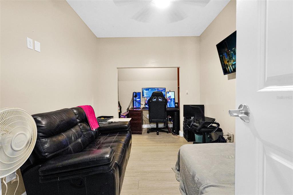 14402 Southwest 157th Path Miami, FL 33196 - Photo 36 of 80 a living room with furniture and a flat screen tv