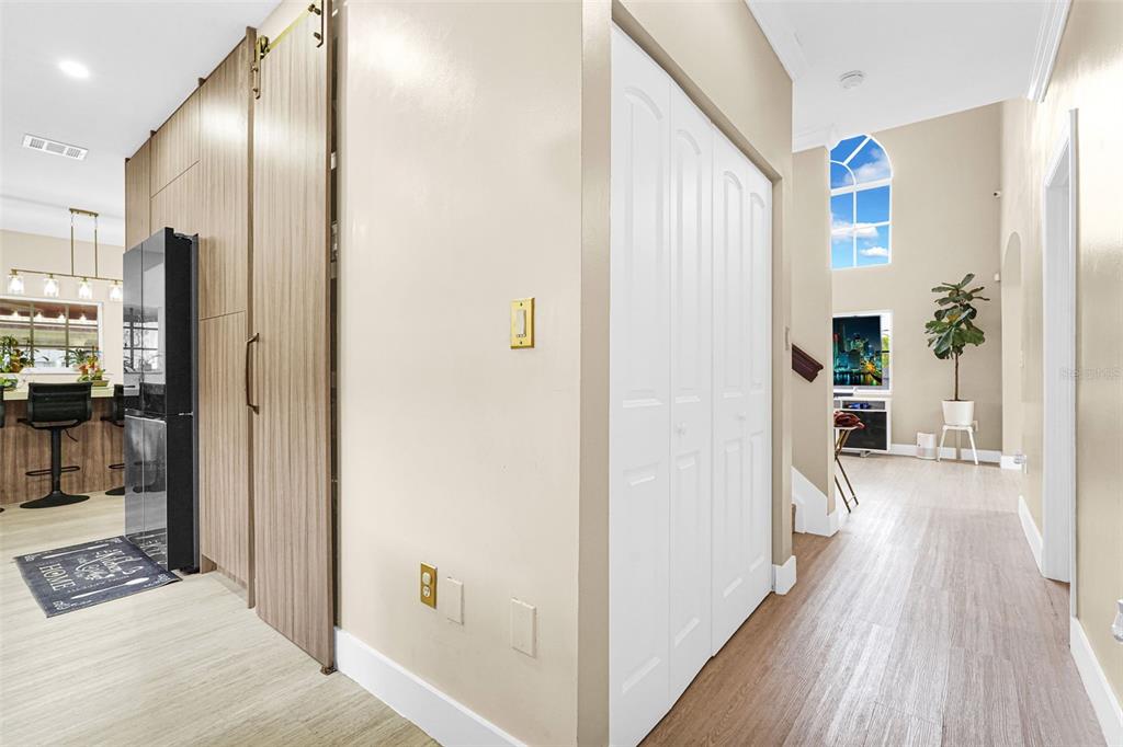 14402 Southwest 157th Path Miami, FL 33196 - Photo 39 of 80 a view of a hallway with wooden floor and a living room