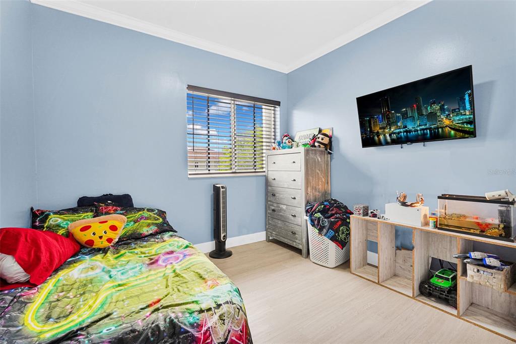 14402 Southwest 157th Path Miami, FL 33196 - Photo 44 of 80 a bedroom with bed and a window