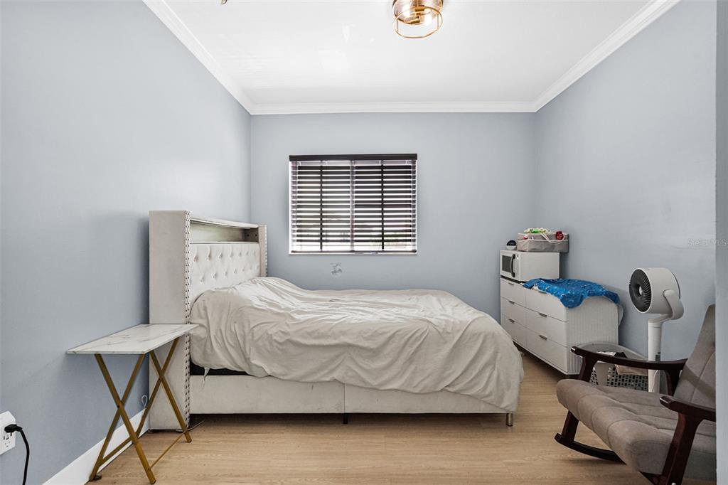 14402 Southwest 157th Path Miami, FL 33196 - Photo 46 of 80 a bedroom with a bed and a window