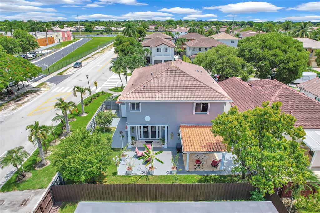 14402 Southwest 157th Path Miami, FL 33196 - Photo 67 of 80 an aerial view of a house with a yard and potted plants