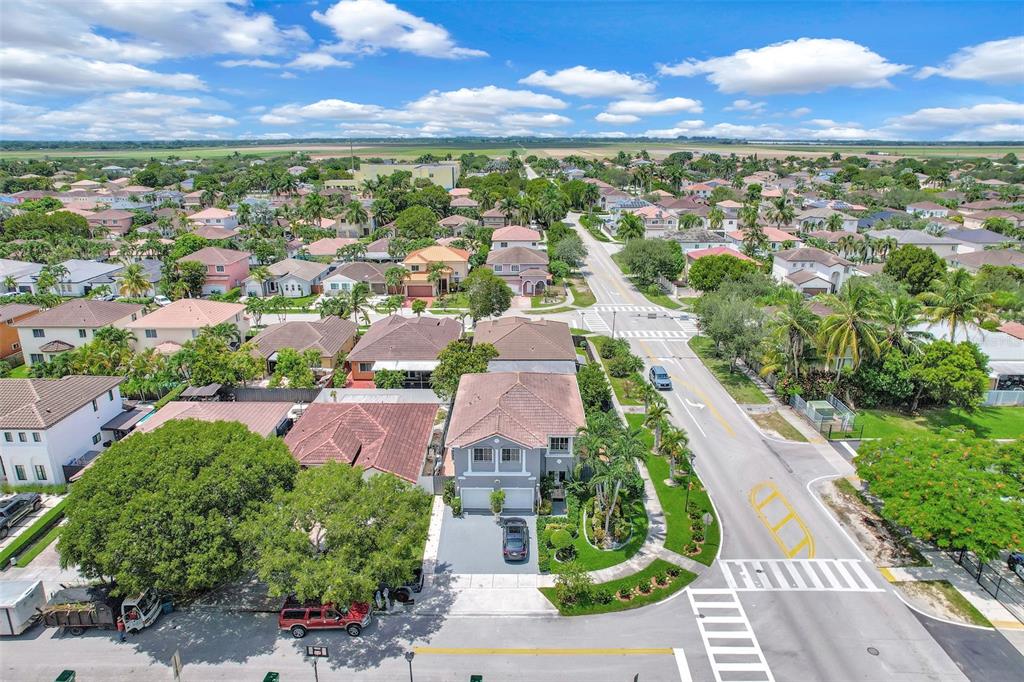 14402 Southwest 157th Path Miami, FL 33196 - Photo 68 of 80 an aerial view of residential houses with outdoor space and ocean view