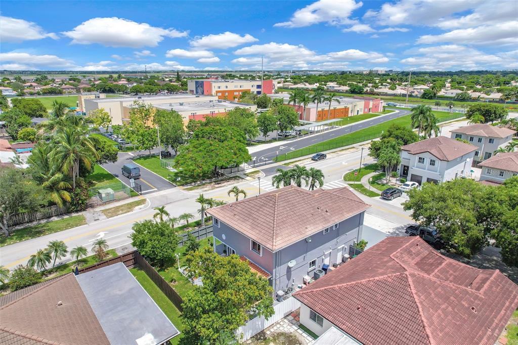 14402 Southwest 157th Path Miami, FL 33196 - Photo 72 of 80 an aerial view of residential houses with outdoor space and ocean view