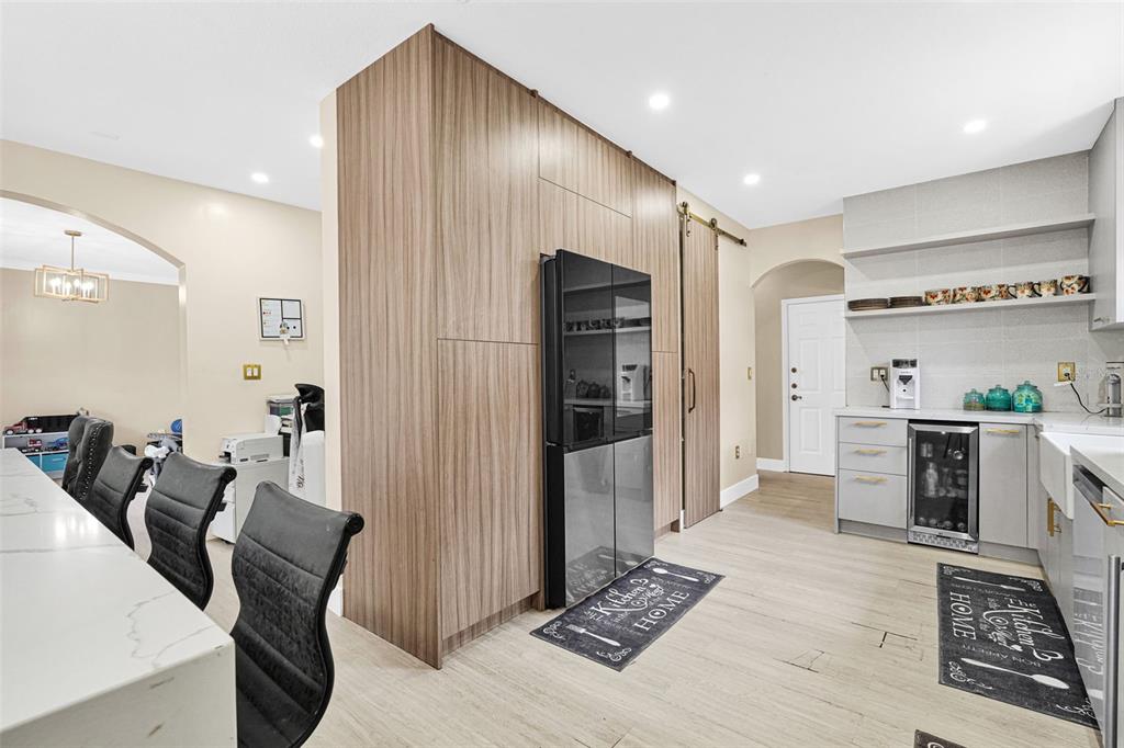 14402 Southwest 157th Path Miami, FL 33196 - Photo 10 of 80 a living room with furniture and a open kitchen view