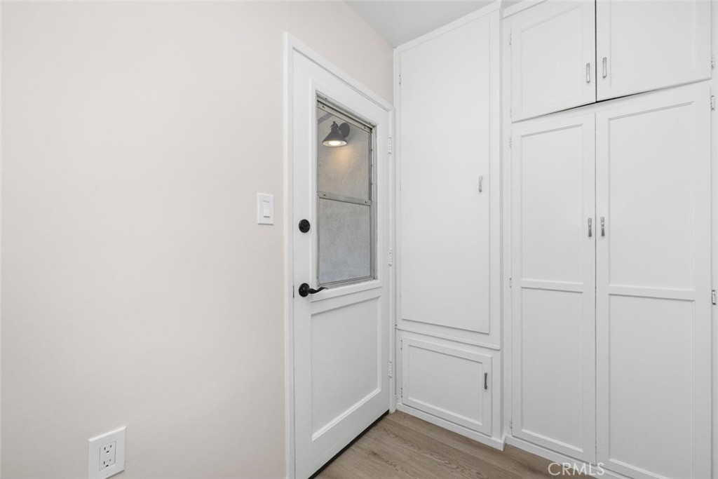 3819 North Studebaker Road Long Beach, CA 90808 - Photo 35 of 62 Laundry room has additional storage space and access to backyard.
