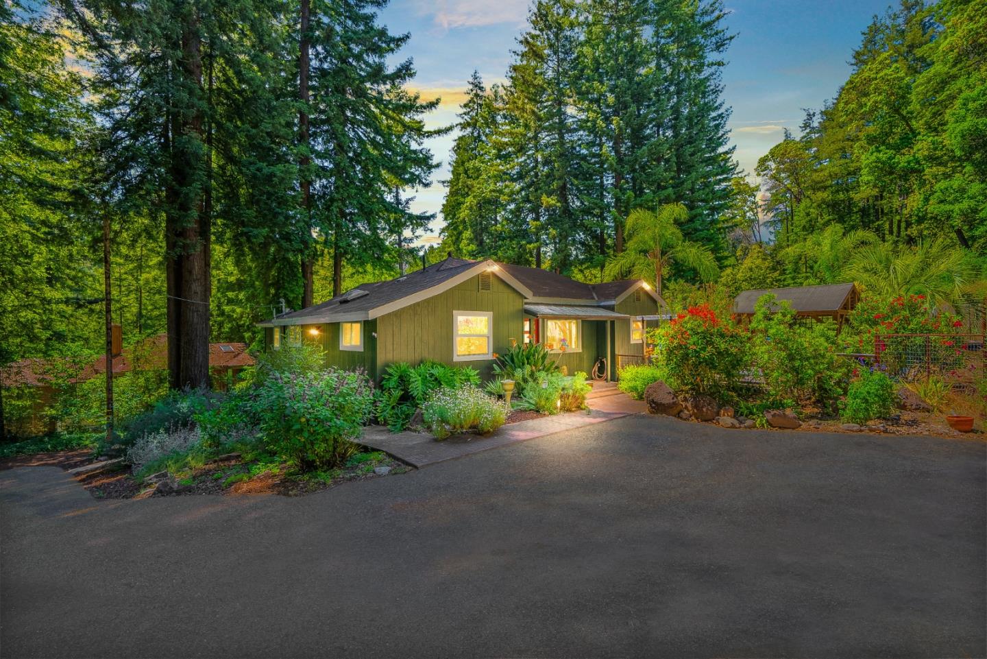 11150 Riverside Road Brookdale, CA 95005 - Photo 1 of 55 a front view of a house with yard and green space