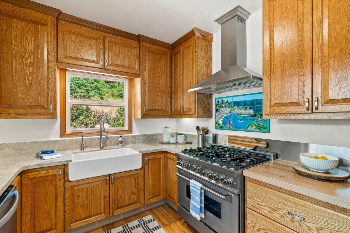 11150 Riverside Road Brookdale, CA 95005 - Photo 19 of 55 a kitchen with granite countertop a sink stove and cabinets