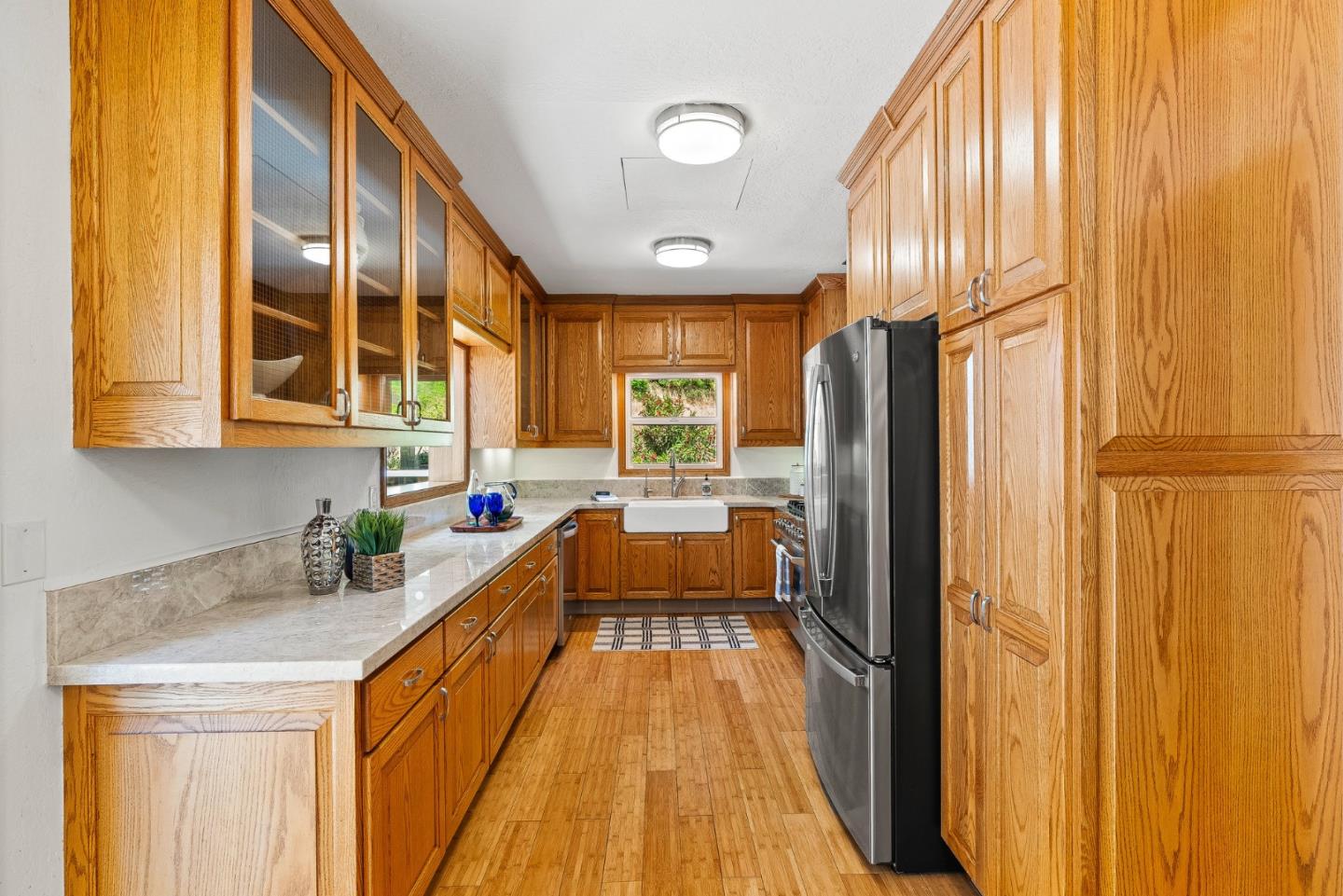 11150 Riverside Road Brookdale, CA 95005 - Photo 20 of 55 a kitchen with stainless steel appliances granite countertop a refrigerator a sink dishwasher and wooden cabinets with wooden floor