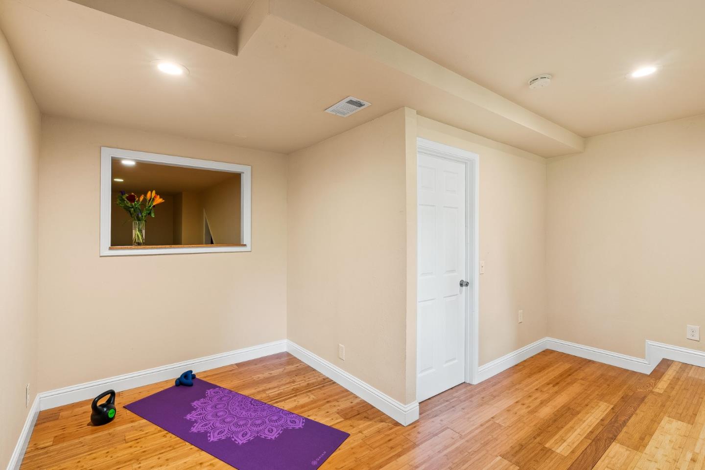 11150 Riverside Road Brookdale, CA 95005 - Photo 43 of 55 a bedroom with a bed and a lamp with wooden floor