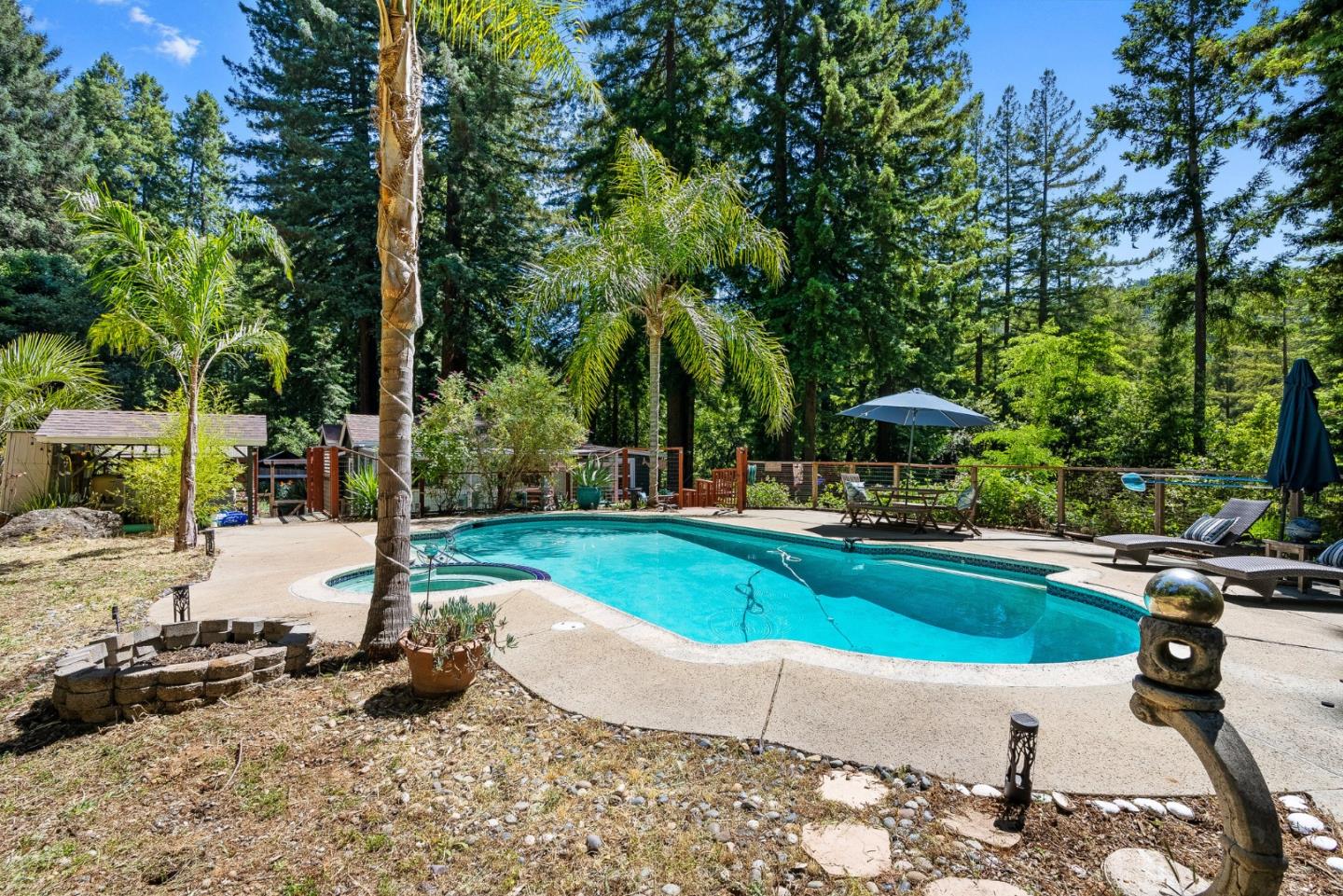 11150 Riverside Road Brookdale, CA 95005 - Photo 49 of 55 a swimming pool with outdoor seating and yard