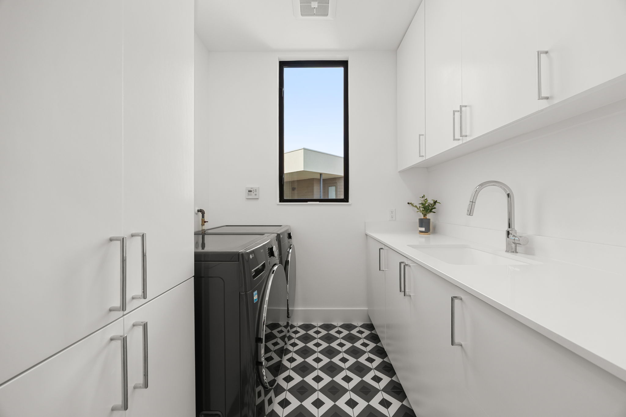 2524 Doc Reeves Street Austin, TX 78723 - Photo 21 of 36 Patterned tile flooring and sleek minimalist cabinetry define this highly functional workspace.