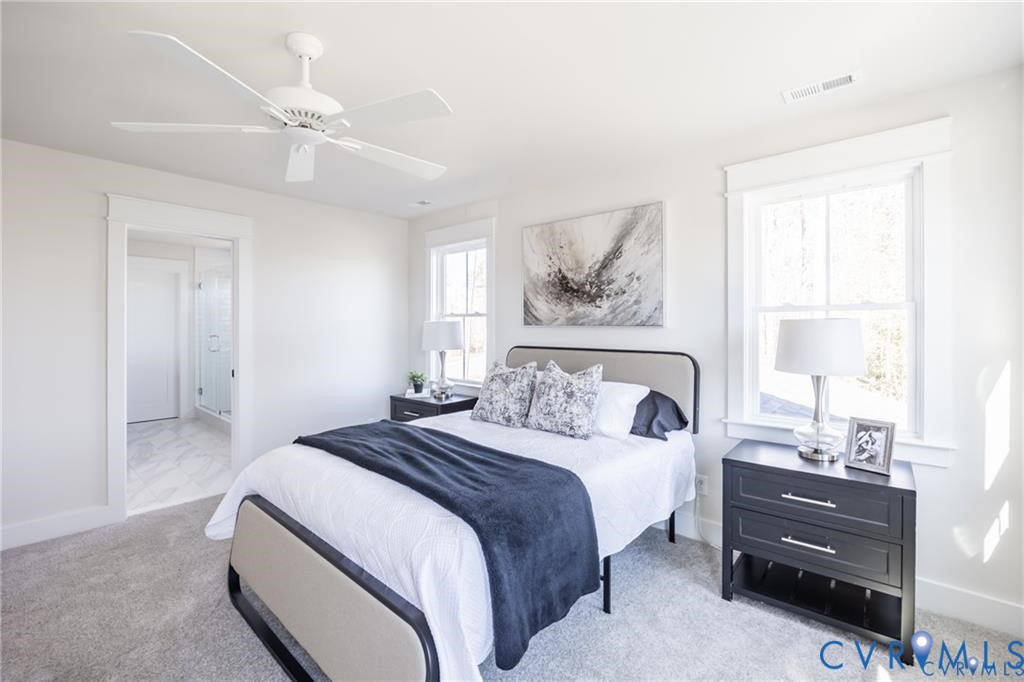 17601 Blue Is Place Moseley, VA 23120 - Photo 22 of 46 a bedroom with a bed and a painting on the wall