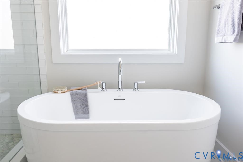 17601 Blue Is Place Moseley, VA 23120 - Photo 24 of 46 a white bath tub sitting in a bathroom