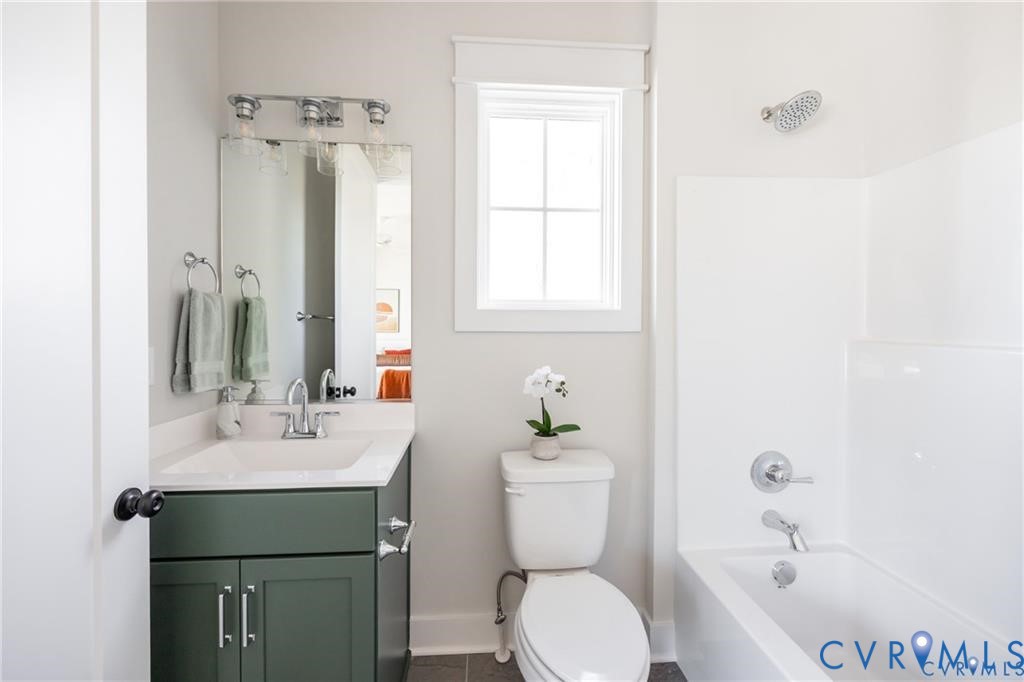17601 Blue Is Place Moseley, VA 23120 - Photo 28 of 46 a bathroom with a sink a toilet and shower curtain
