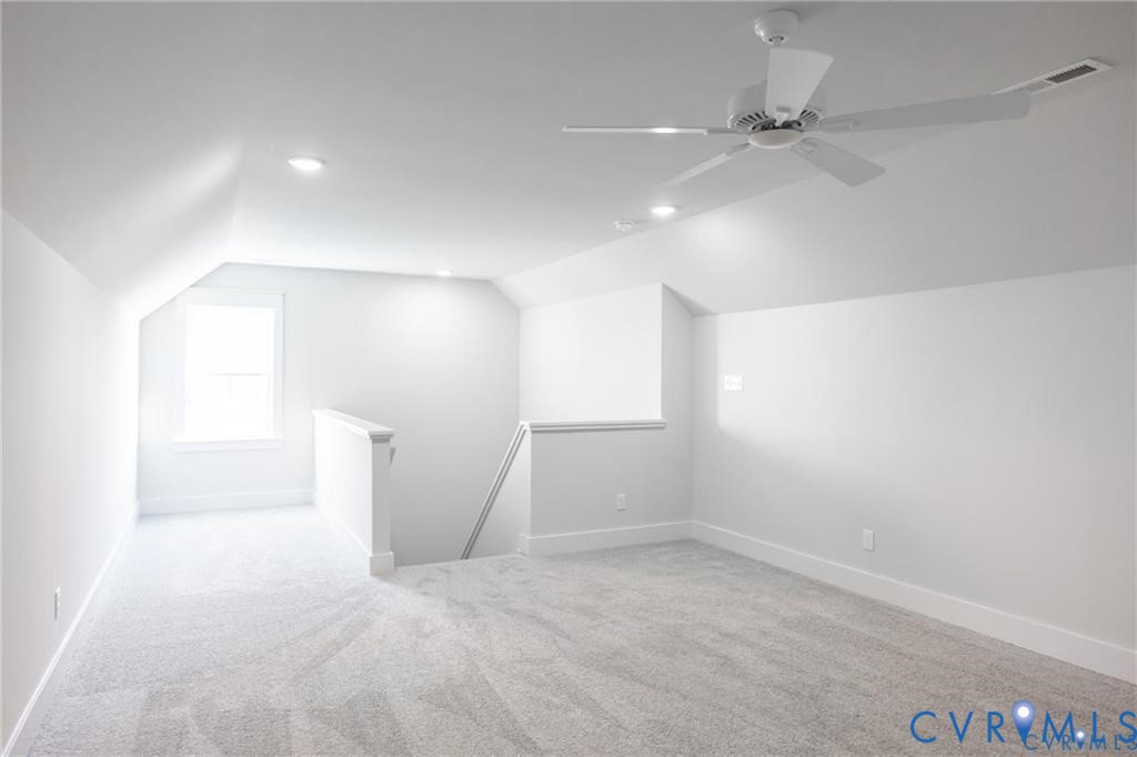 17601 Blue Is Place Moseley, VA 23120 - Photo 30 of 46 an empty room with a ceiling fan and windows