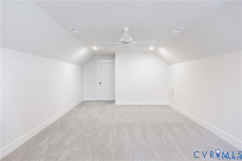 17601 Blue Is Place Moseley, VA 23120 - Photo 35 of 46 an empty room with a ceiling fan and a bathroom