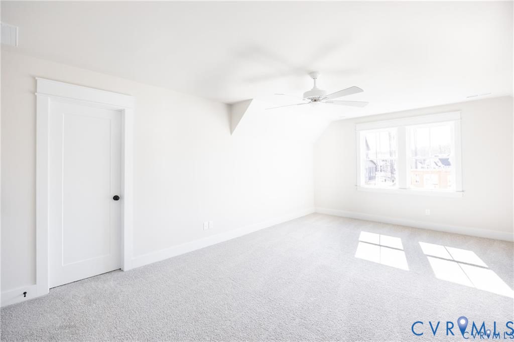 17601 Blue Is Place Moseley, VA 23120 - Photo 36 of 46 an empty room with a window and a ceiling fan