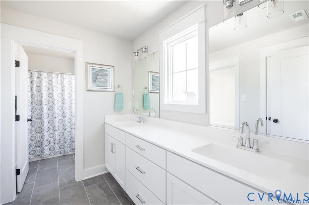 17601 Blue Is Place Moseley, VA 23120 - Photo 38 of 46 a bathroom with a double vanity sink mirror and double