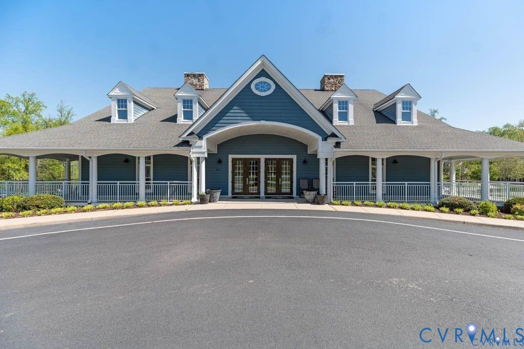 17601 Blue Is Place Moseley, VA 23120 - Photo 46 of 46 front view of a house with large windows and ceiling fans