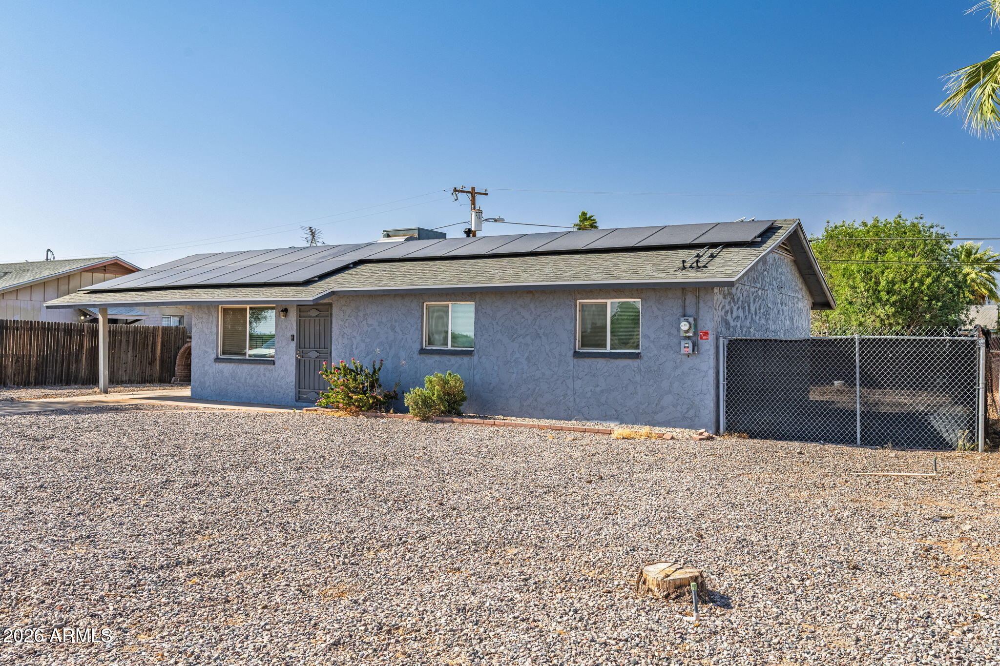 1268 East Rodeo Road Casa Grande, AZ 85122 - Photo 2 of 27 a front view of a house with a yard