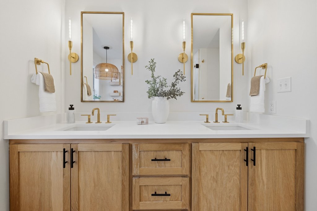 126 Pine View Loop Bastrop, TX 78602 - Photo 20 of 29 Quartz double vanity with designer mirrors, cabinetry, faucets and light fixtures