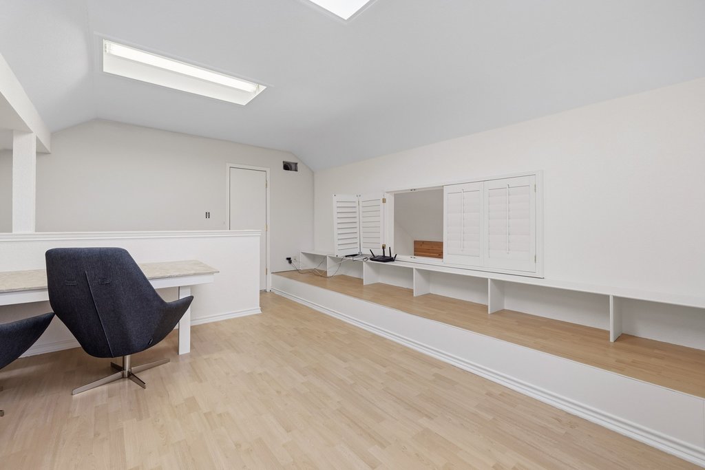 126 Pine View Loop Bastrop, TX 78602 - Photo 23 of 29 Half-story upstairs space currently configured as a home office with built-in desks, easily adaptable for other uses.