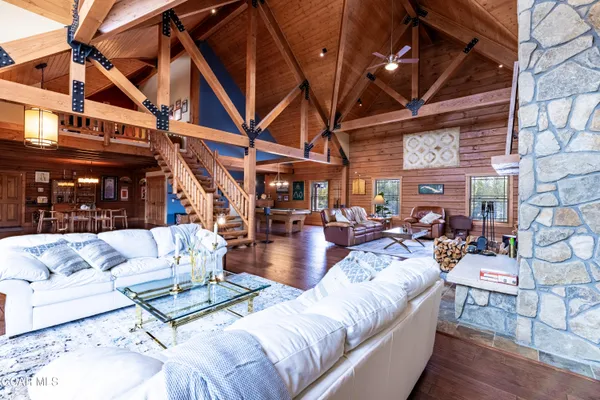 a bathroom with a double vanity sink toilet mirror and bathtub