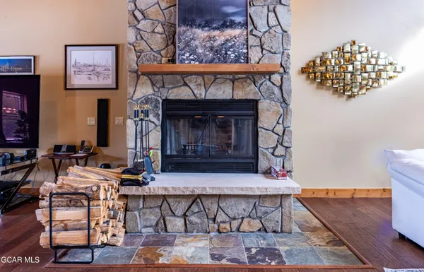 a bed sitting in a room next to a lamp