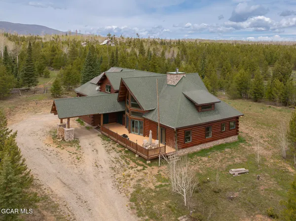 a large kitchen with stainless steel appliances granite countertop a large stove a sink dishwasher and cabinets next to a window