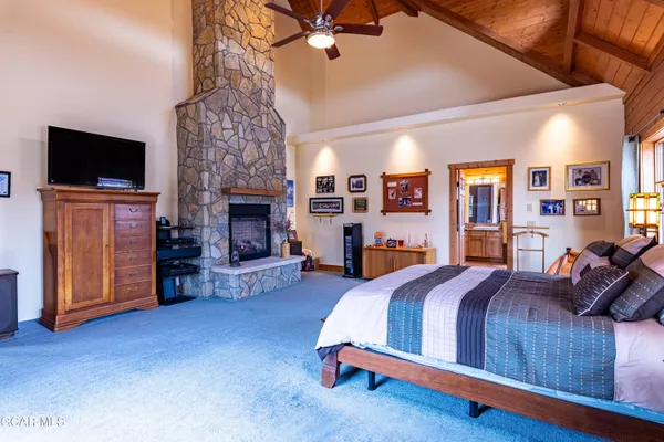 an aerial view of a house with a yard and lake view